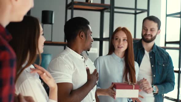 Cheerful Young Business Woman Boss Gives Congratulatory Speech on Behalf of Entire Team. alt