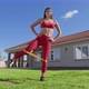 Young Caucasian Woman Performs Banded Leg Lifts to Fire Up Glute Muscles - VideoHive Item for Sale