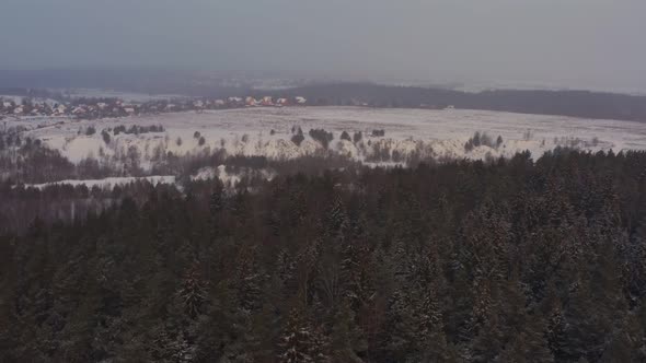 View of the Village in Winter From the Green Forest