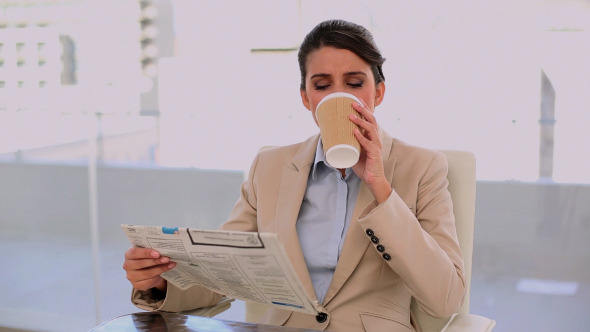 Relaxed Beautiful Businesswoman Drinking Coffee