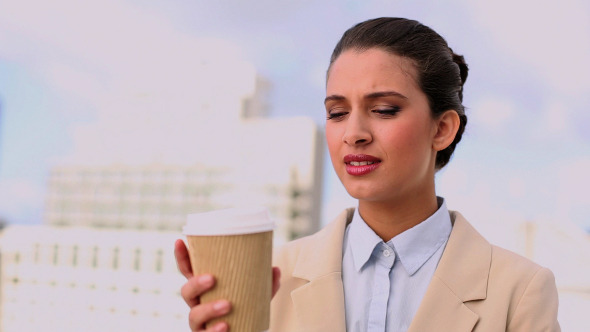 Delighted Beautiful Businesswoman Enjoying Coffee