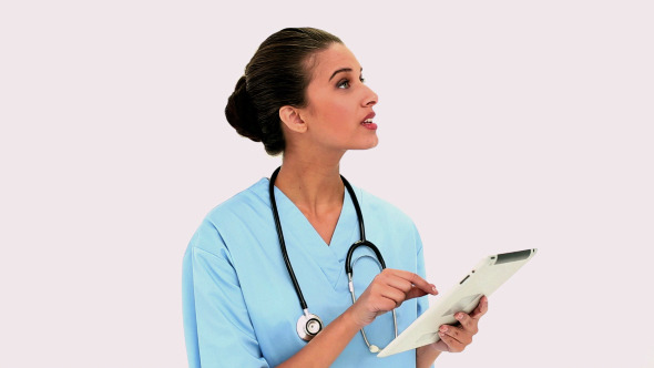 Thoughtful Beautiful Nurse Using A Tablet Pc