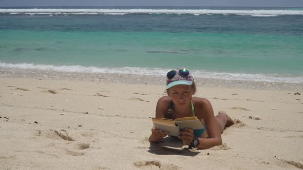 Girl on the Beach Reading a Book alt