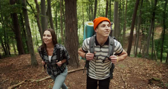 Tourists Going Uphill in Forest