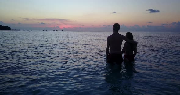 Fun man and woman married on vacation spend quality time on beach on white sand background alt