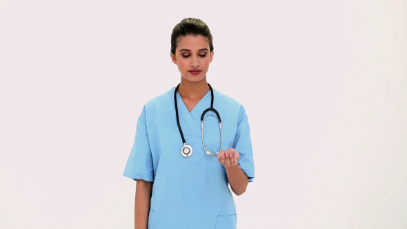 Content Beautiful Nurse Showing Red Pills In Hand