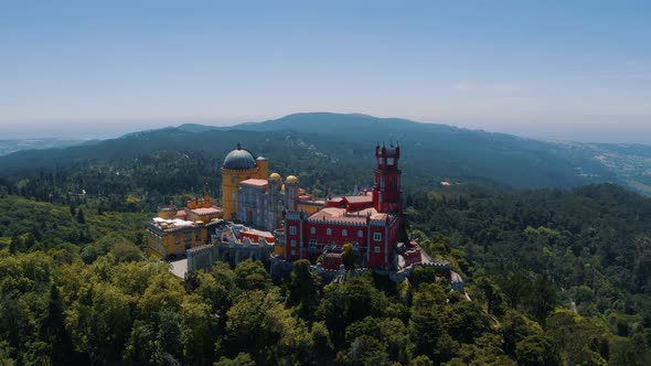 Aerial View of Pena Palace and National Park in Sintra, The Colorful Ancient Castle, Portugal 4K