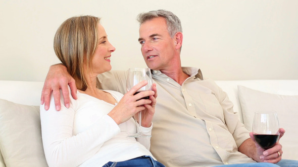 Mature Couple Drinking Red Wine Together alt