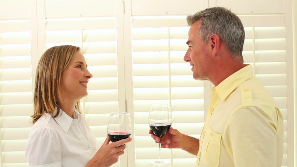 Romantic Mature Couple Drinking Red Wine