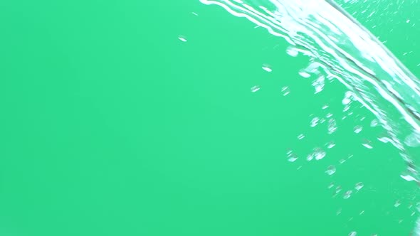Slow Motion of Water Spash with Drops Over Green Screen Chroma Key Background alt