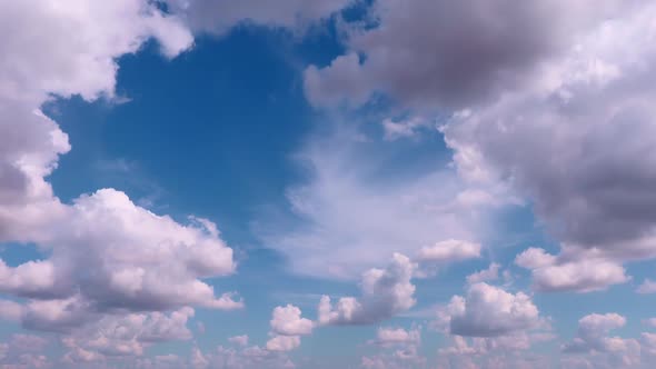 Building motions clouds. Puffy fluffy white clouds sky time lapse. slow moving clouds.