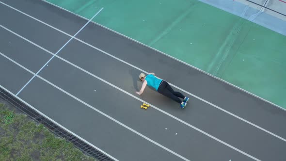Aerial Shot of Overweight Woman Doing Push Ups alt