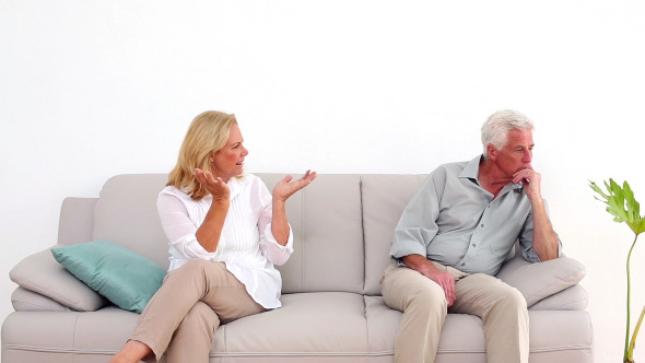 Retired Couple Arguing On The Couch