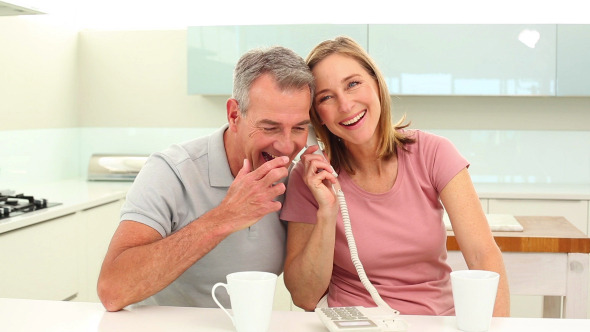 Mature Couple Talking On The Phone