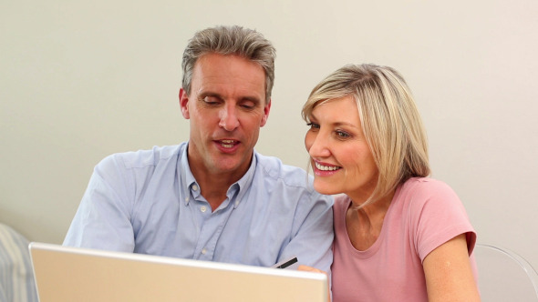 Mature Couple Shopping Online Together