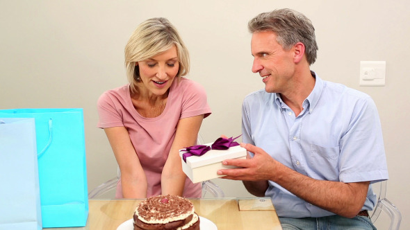 Man Giving His Wife Her Birthday Present