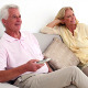 Retired Smiling Couple Watching Television On The - VideoHive Item for Sale