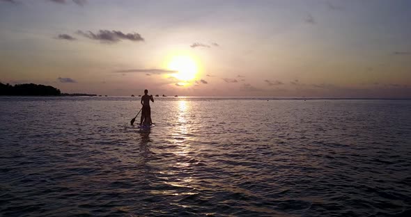 Young people on romantic honeymoon live the dream on beach on summer white sandy 4K background alt