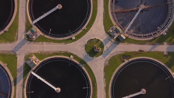 Sludge Scraper On Circular Tanks At Detroit Wastewater Treatment Plant In Michigan, USA. - aerial alt