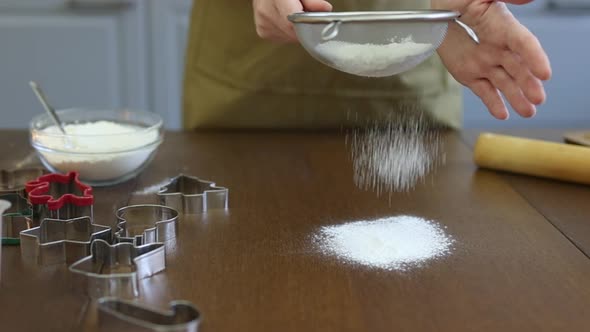 Baking Cookies Homemade Dough Sifting Flour Through Sieve on Brown Wooden Table alt