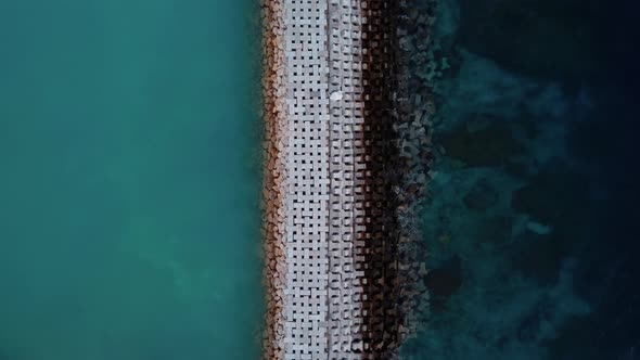 Top Down View on Wave Breaker on Balinese Beach alt