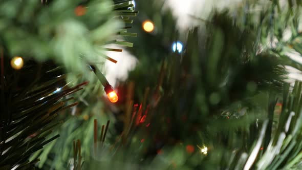 Illuminated sequence of fairy lights  on the garland close-up 4K 2160p 30fps UltraHD footage - Mini  alt