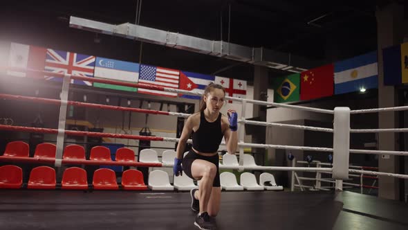 Fit Female Boxer Training in a Boxing Hall alt