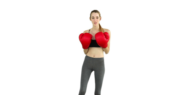Fit Model Punching With Red Boxing Gloves