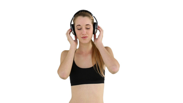 Fit Model Listening To Music And Smiling