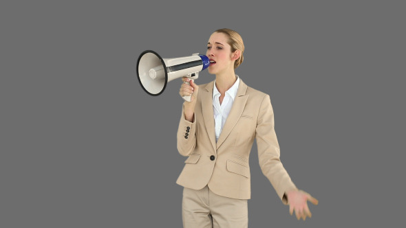 Positive Businesswoman Shouting In To Megaphone 2