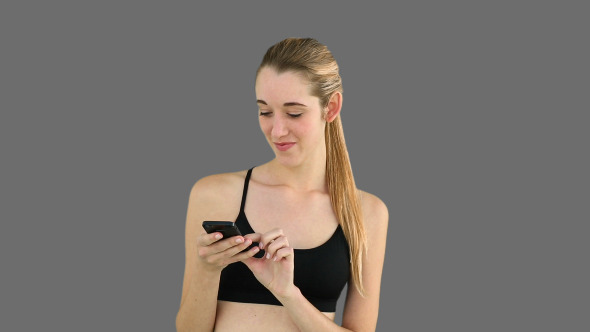Fit Model Texting On Her Phone 2