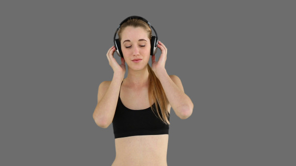 Fit Model Listening To Music And Smiling 2