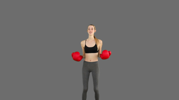 Fit Model Cheering With Red Boxing Gloves 5