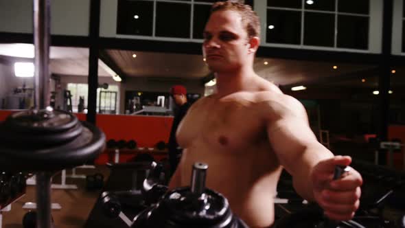 Man lifting a barbell alt