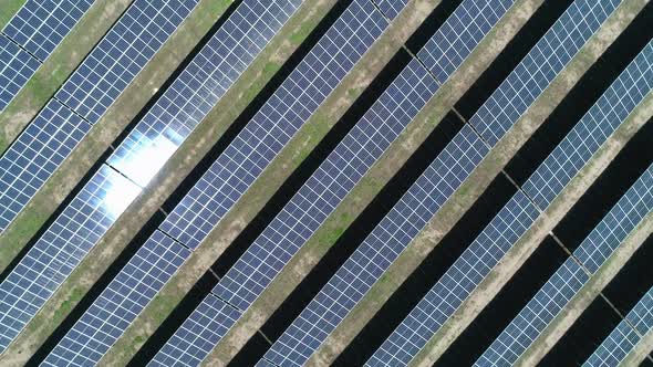 Aerial Top Down View of Solar Power Station Field at Sunny Day. Aerial Top View of Solar Farm alt