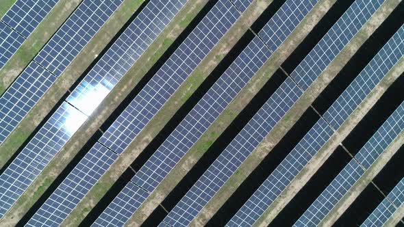 Aerial Top Down View of Solar Power Station Field at Sunny Day. Aerial Top View of Solar Farm