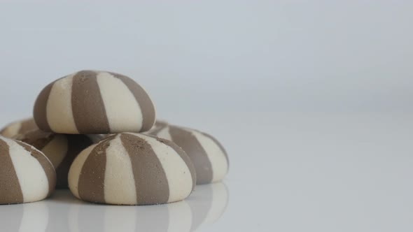 Tilting over cookies with milk and chocolate 4K 2160p 30fps UltraHD footage - Close-up of bicolor te alt