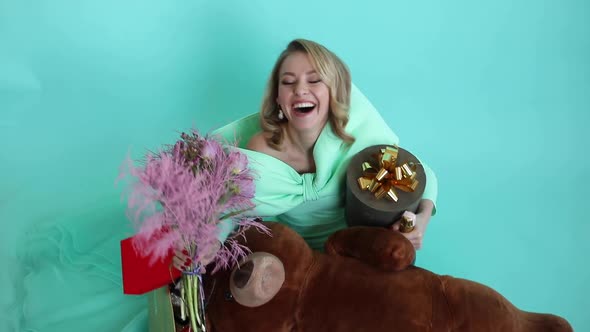 A Beautiful Woman with Gifts in the Studio