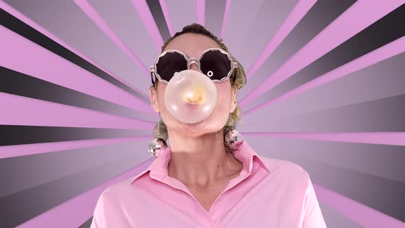 Woman With Party Glasses Chewing Gum And Make Bubble On Spinning Pink Rays Background