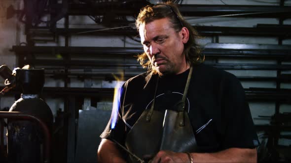 Welder burning welding torch alt