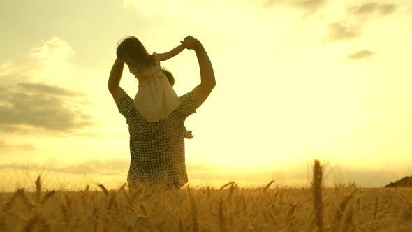 Happy Family and Childhood Concept. Little Daughter on Father's Shoulders. Child and Father Are alt