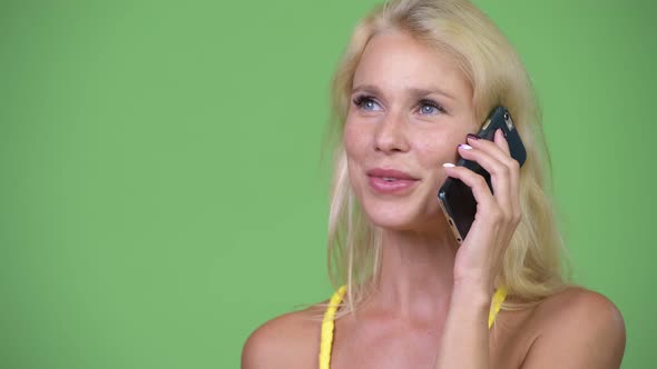 Young Happy Beautiful Blonde Woman Talking on the Phone