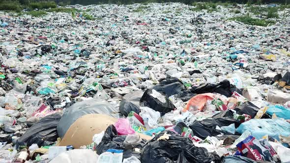 Garbage in the canals after the flood. Contaminated rivers with plastic waste. alt