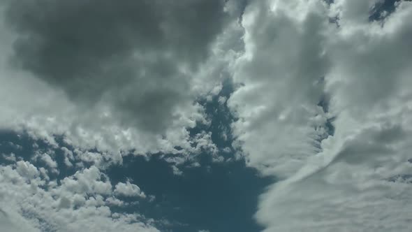 Natural Cumulus Rain Clouds On Blue Clean Sky alt
