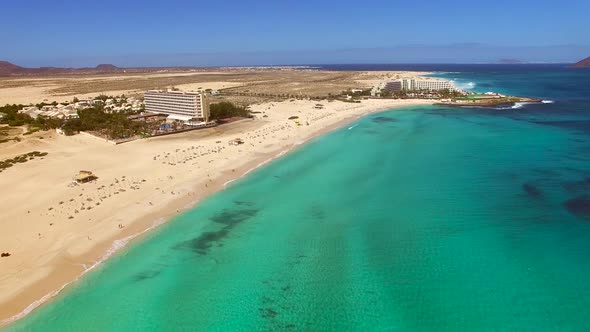 Aerial view of Corralejos Big Beaches with turquoise sea in Fuerteventura. alt