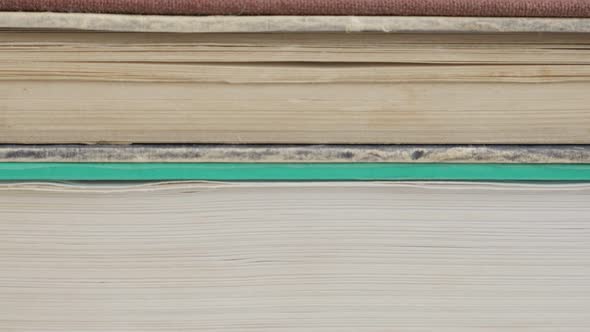 Stacked deckle edge paper material or archives slow tilt 4K 2160p 30fps UltraHD footage - Vintage bo alt