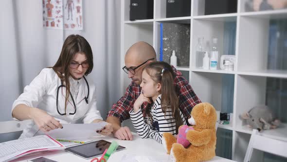 Father with His Little Daughter on the Family or Children's Doctor