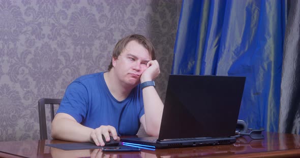 Plump Man Freelancer Gets Tired Working on Computer at Home alt