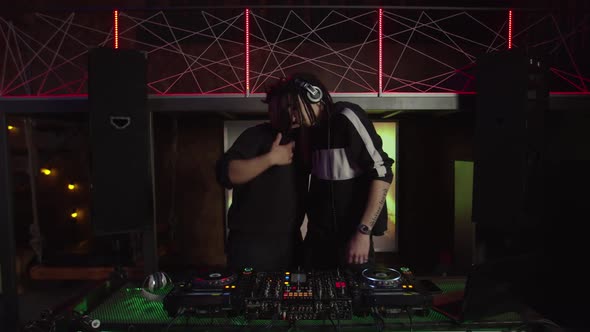 Black Male Clubber Greeting and Asking Modern Dj to Play Techno Dance Music in Nightclub alt