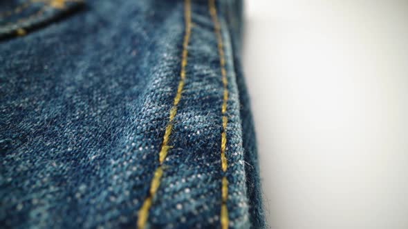 Extreme Detailed of Blue Denim Jeans Texture in Dolly Shot Over Cloth Surface alt